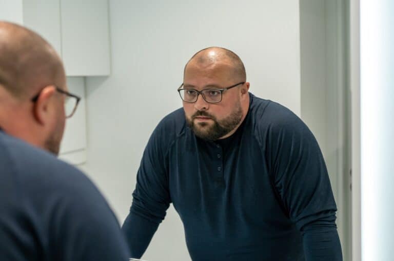 man not happy with reflection in mirror